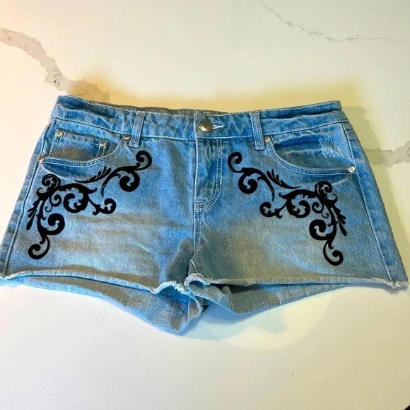 Material Girl light wash jean shorts with black velvet embellishments. Size 7 - Picture 1 of 9